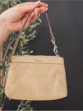Coach Beige Perforated Leather Mini Wristlet